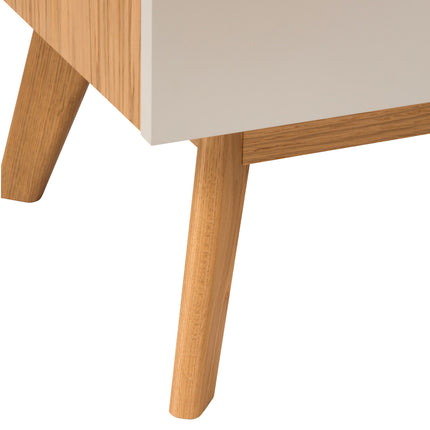 Close-up of a wooden sideboard oak legs on a white background