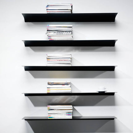 Set of black wall shelves with books on a white background