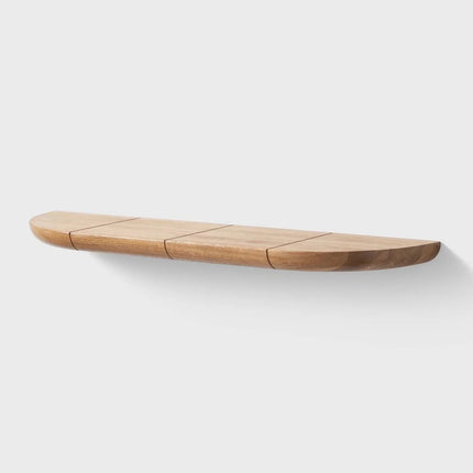 Curved wooden design shelf on a white background