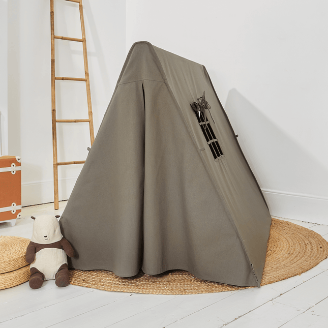 Gray pet playpen with a teddy bear and suitcase on a white floor.