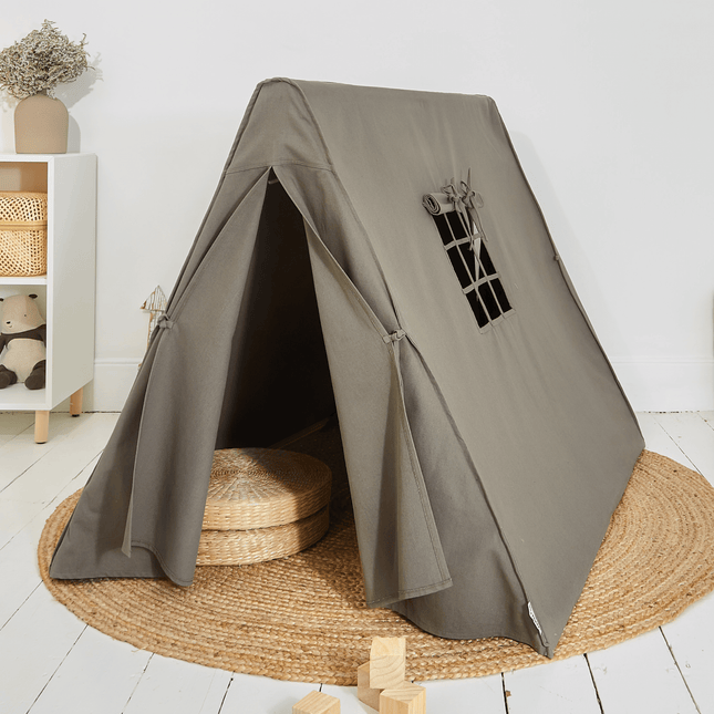 Children's gray teepee play tent with a small window on a white floor.