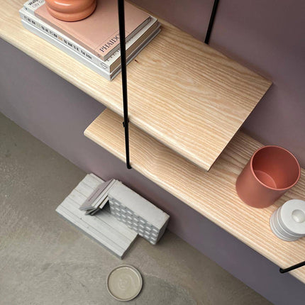 close up image of the solid ash shelf showing wood grain