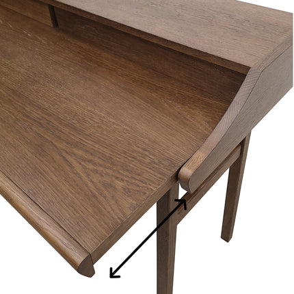 carteret vintage Wooden desk with a focus on the corner where two surfaces meet