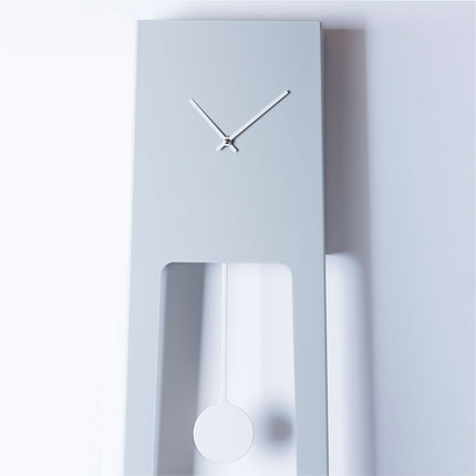 Modern wall clock with a minimalist design on a white background