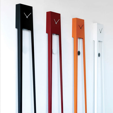 Four modern grandfather wall clocks in black, red, orange, and white on a white background with pendulums 