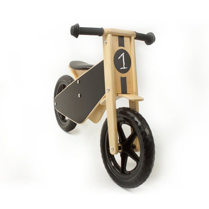 front view of black balance bike with chalkboard