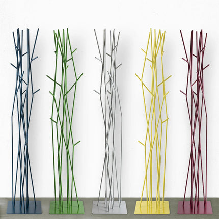 Modern coat racks with different coloured branches on a white background