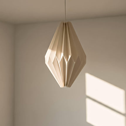 origami lampshade hanging from ceiling with light off