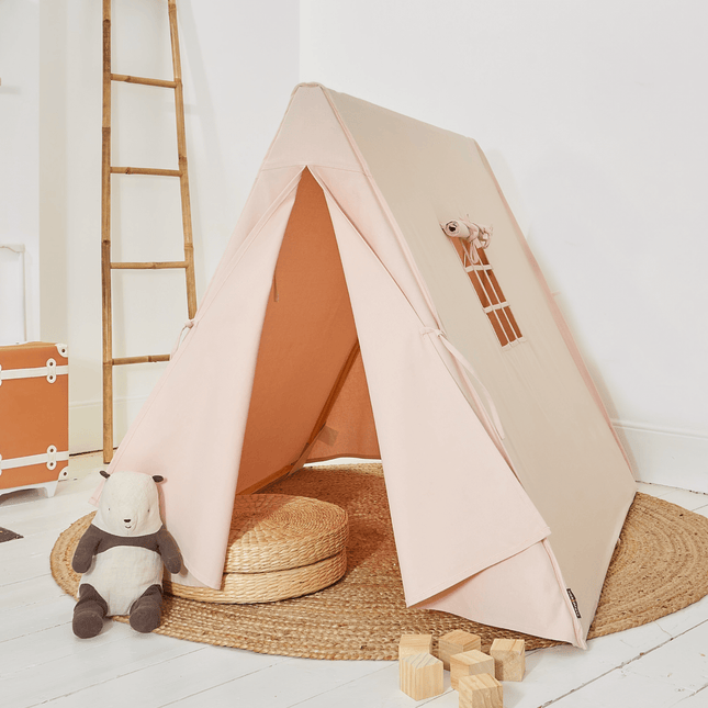 Children's play tent with a ladder and toys on a wooden floor.