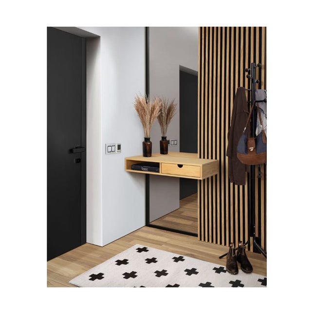 Modern entryway with wooden console table, mirror, and striped wall.
