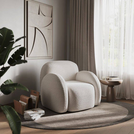 Scandi armchair in a stylish living room with decor elements.