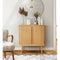 Wooden tambour highboard with decorative items in a room with a chair and mirror.